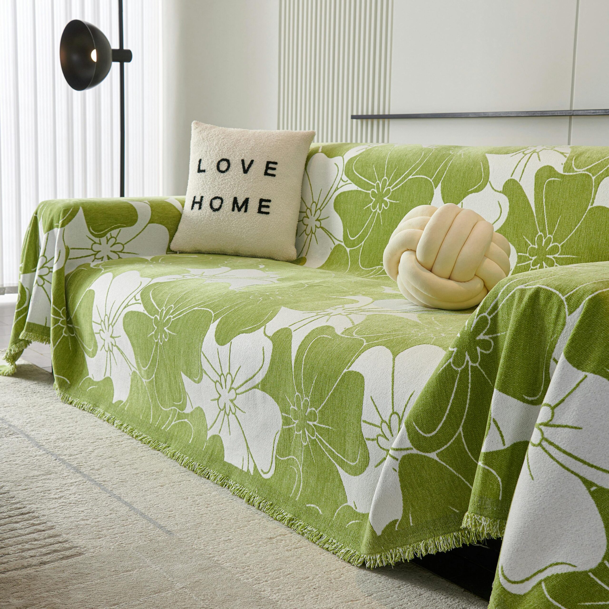 Cozy living room with a floral sofa throw and stylish cushions for modern home decor.